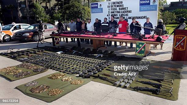 Ten alleged drugdealers members of the "Arellano Felix" drug cartel are shown to the press with a arsenal of weapons and ammunition in Tijuana city,...