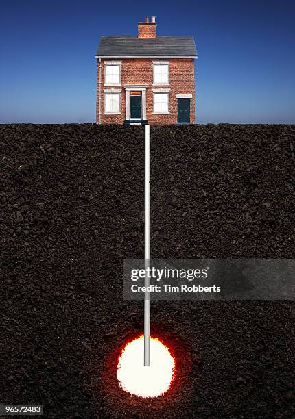 model house powered by geothermal heat. - house cross section stock pictures, royalty-free photos & images