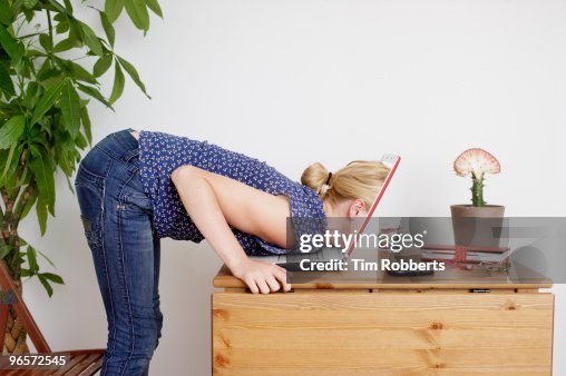 Woman Head Over Computer Screen Young Woman Peering Inside Laptop Screen High-Res Stock Photo - Getty ...