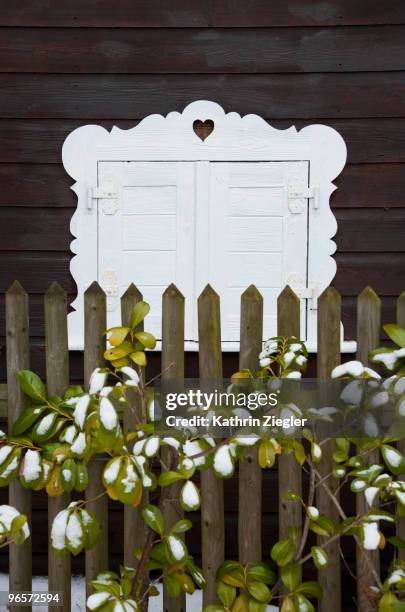 window with closed shutters, bavarian style - kathrin ziegler stockfoto's en -beelden