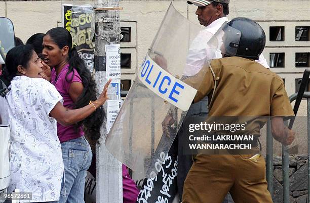 Sri Lanka police baton charge demonstrators in the eastern Colombo suburb of Maharagama on February 11, 2010. Sri Lankan police used batons and tear...