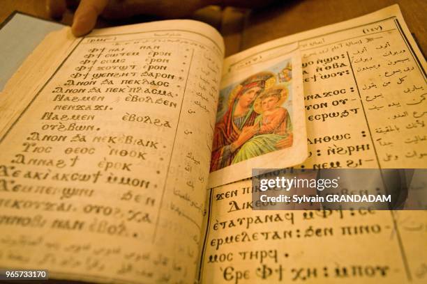 Reading and singing in old coptic language. Theodoros El-Morhab coptic church and monastery on first sunday after Easter. West bank of river Nile,...