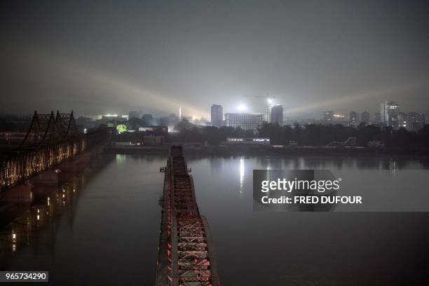 The North Korean town of Sinuiju is seen from the Chinese border town of Dandong, in China's northeast Liaoning province on May 31, 2018. - he city...