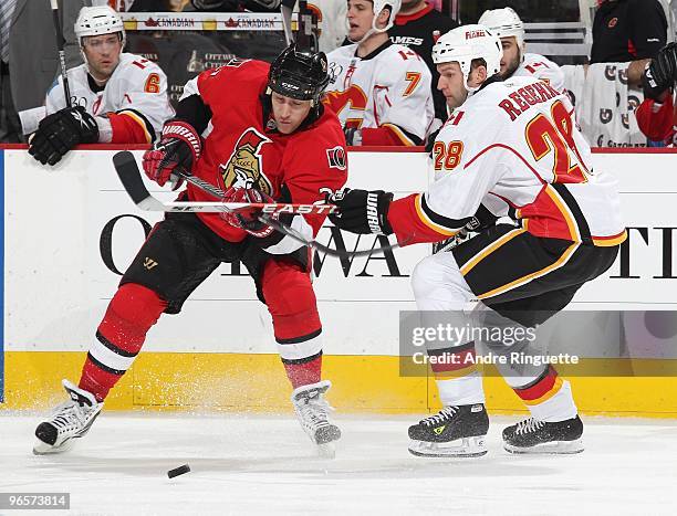 Alexei Kovalev of the Ottawa Senators battles for puck possession against Robyn Regehr of the Calgary Flames at Scotiabank Place on February 9, 2010...