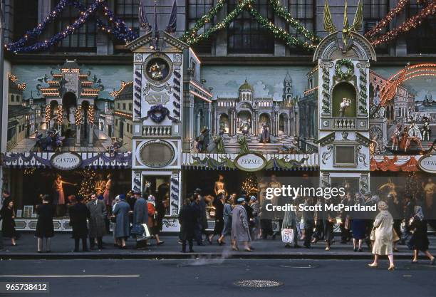 New York City - People gather out in front of Saks Fifth Avenue during the Christmas holiday season.