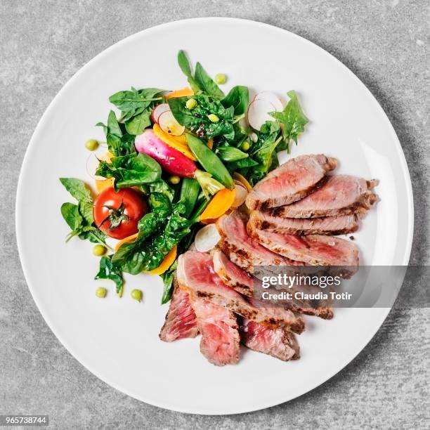 steak with fresh salad - golden beet stock pictures, royalty-free photos & images