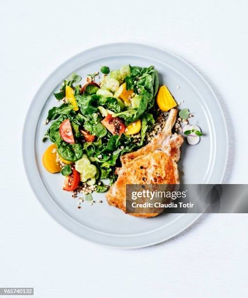 roasted pork chop with salad - plate directly above stock pictures, royalty-free photos & images