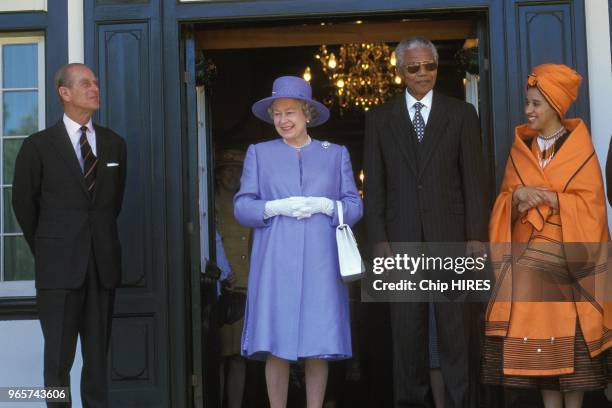 Queen Elizabeth II and Prince Philip received by Nelson Mandela and Rochelle Mtirara in South Africa, March 20, 1995.