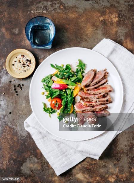 steak with fresh salad - golden beet stock pictures, royalty-free photos & images