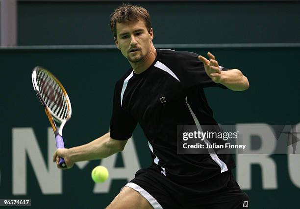 Marco Chiudinelli of Switzerland in action in his match against Novak Djokovic of Serbia during day four of the ABN AMBRO World Tennis Tournament on...