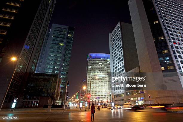 Pedestrians walk through Beijing's Financial Street in Beijing, China, on Thursday, Feb. 4, 2010. In the third quarter of last year, Beijing's office...