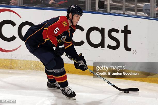 Bryan Allen of the Florida Panthers skates with the puck against the Calgary Flames at the BankAtlantic Center on February 5, 2010 in Sunrise,...