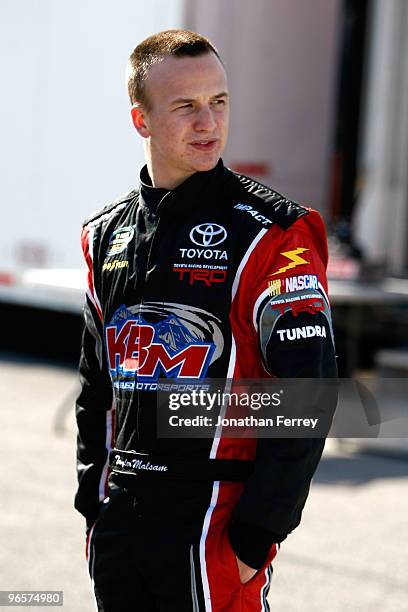 Tayler Malsam, driver of One Eighty Toyota, stands in the garage area during practice for the NASCAR Camping World Truck Series NextEra Energy...