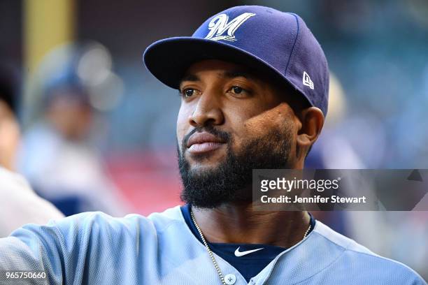 Domingo Santana of the Milwaukee Brewers reacts in the dugout during the MLB game against the Arizona Diamondbacks at Chase Field on May 15, 2018 in...