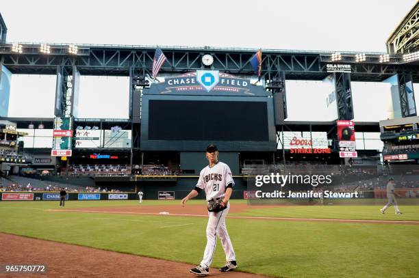 Zack Greinke of the Arizona Diamondbacks walks off the field after pitching the first inning of the MLB game against the Milwaukee Brewers at Chase...