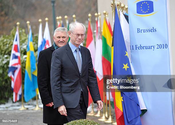 Herman Van Rompuy, president of the European Council, right, arrives for the European Union Summit in Brussels, Belgium, on Thursday, Feb. 11, 2010....