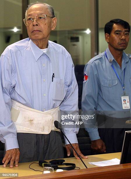 Former Khmer Rouge deputy prime minister and minister of foreign affairs Ieng Sary stands in the courtroom during a public hearing at the...