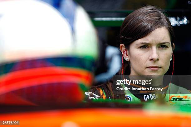 Danica Patrick, driver of the Go Daddy Chevrolet, stands in the garage area during practice for the NASCAR Nationwide Series DRIVE4COPD 300 at...
