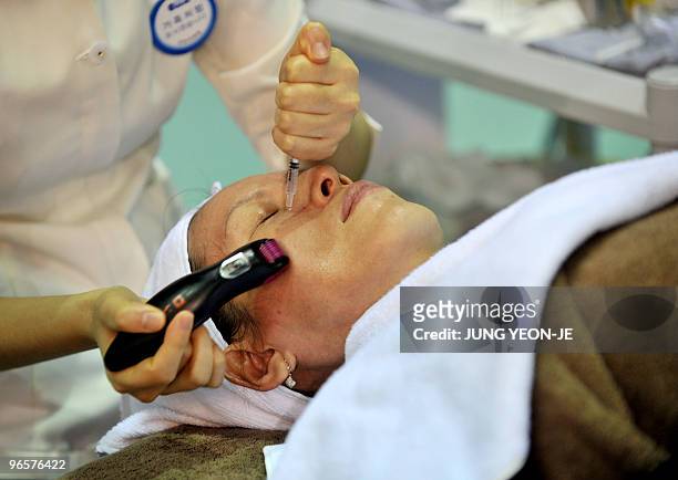 Health-medicine-tourism-SKorea,FEATURE, by Lim Chang-Won A South Korean woman receives skincare treatment during a medical tourism expo in Seoul on...