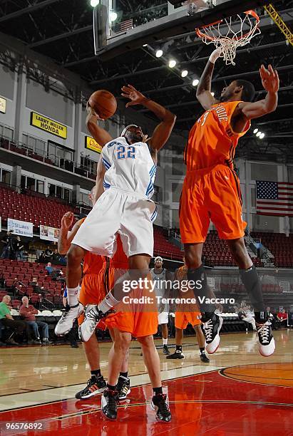 Mustafa Shakur of the Tulsa 66ers takes the ball to the basket against Kurt Looby of the Albuquerque Thunderbirds during the 2010 D-League Showcase...