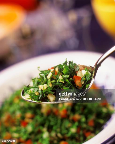 Chopped two sprigs of flat parsley. Chop tomatoes into cubes. Finely chop half an onion. Mix it all together and add a soup spoon of bulgur. Cool and...