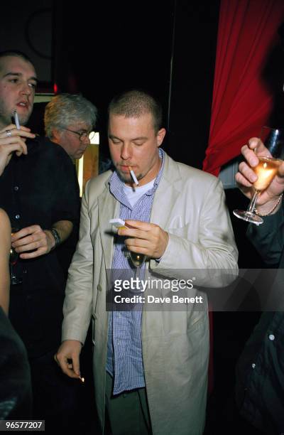 English fashion designer Alexander McQueen attends a Vogue 'Visionaire' party at Harvey Nichols, London, 24th February 1999.
