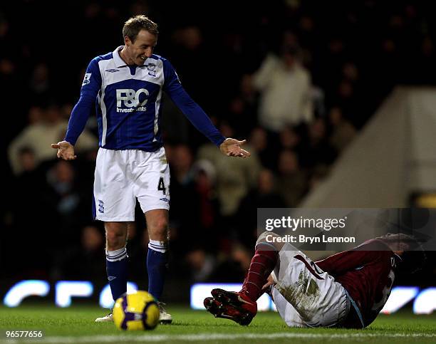 Lee Bowyer of Birmingham City reacts an incident with Alessandro Diamanti of West Ham during the Barclays Premier League match between West Ham...