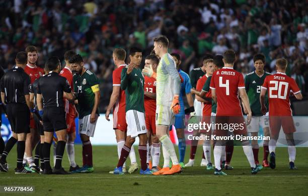 Goalkeeper Wayne Hennessey of Wales is congratulated by Hugo Ayala of Mexico after their friendly international soccer match at the Rose Bowl on May...