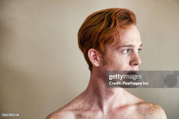 studio portrait of red head - freckle stock pictures, royalty-free photos & images