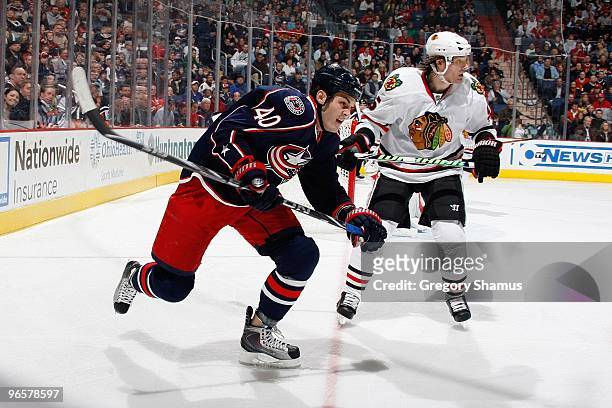 Jared Boll of the Columbus Blue Jackets skates against Brent Sopel of the Chicago Blackhawks on January 16, 2010 at Nationwide Arena in Columbus,...