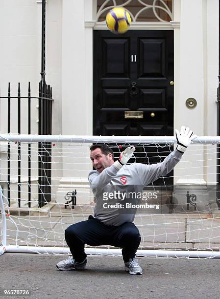 David Seaman, former football goalkeeper for England, saves a penalty kick from a member of M13, the team which will be representing England at the...