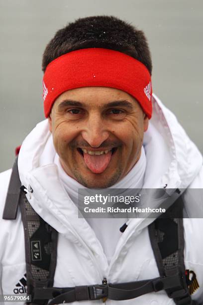 Georg Hackl, national team coach of Germany jokes around prior to the Men's Singles training run at the Whistler Sliding Centre ahead of the...