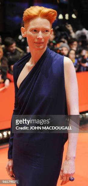 British actress Tilda Swinton poses for photographers as she arrives for the premiere of the film "Apart Together" competing in the 60th Berlinale...