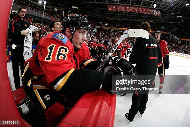 Dustin Boyd of the Calgary Flames sits on the bench during a stoppage in play against the Carolina Hurricanes on February 3, 2010 at Pengrowth...