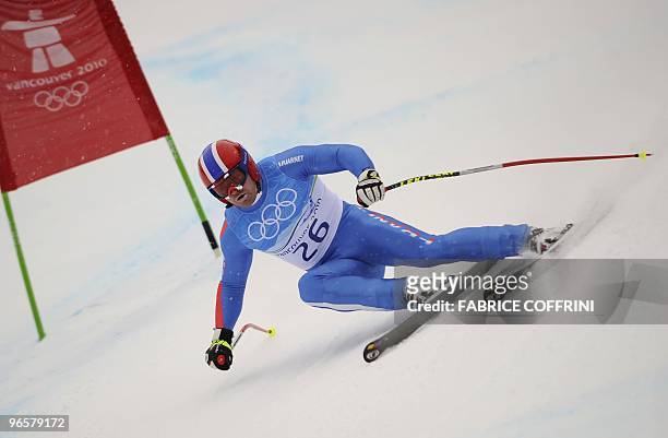France's David Poisson takes a curve during the first official training for the Men's Olympic downhill at Whistler Creek side Alpine skiing venue on...