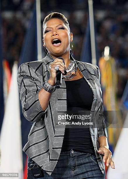 Singer Queen Latifah performs on the field prior to the start of Super Bowl XLIV between the Indianapolis Colts and the New Orleans Saints on...