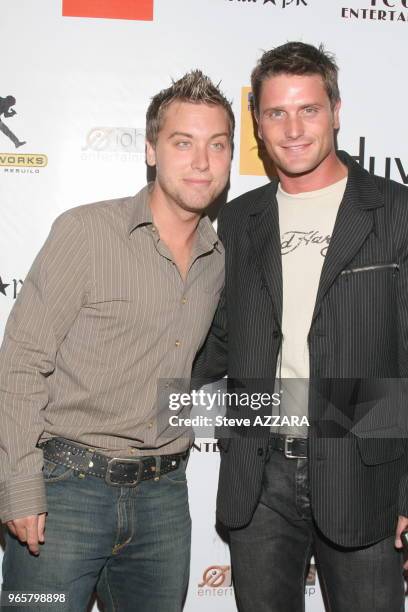 Lance Bass and Reichen Lehnkuhl at the VIP VMA after party hosted by Wyclef Jean at Duvet in NY, New York. Eye contact smile Steve Azzara.