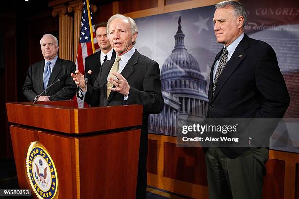 Sen. Joseph Lieberman speaks as Sen. John McCain , Sen. Evan Bayh , and Sen. Jon Kyl listen during a news conference on Capitol Hill February 11,...