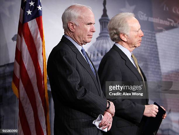 Sen. John McCain and Sen. Joseph Lieberman listen during a news conference on Capitol Hill February 11, 2010 in Washington, DC. The senators held a...