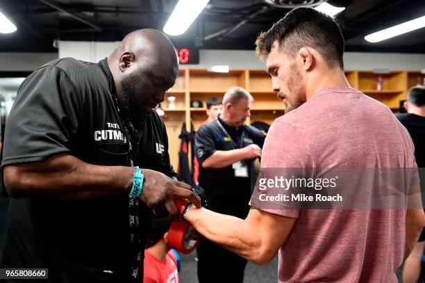 Jake Ellenberger gets his hands wrapped backstage during the UFC Fight Night event at the Adirondack Bank Center on June 1, 2018 in Utica, New York.