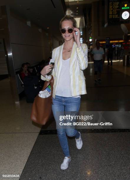 Poppy Delevingne is seen at LAX on May 31, 2018 in Los Angeles, California.