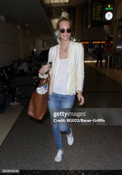 Poppy Delevingne is seen at LAX on May 31, 2018 in Los Angeles, California.