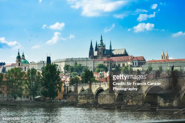 majestic prague skyline with hradcany castle, st. vitus cathedral and monumental charles bridge over vltava river in czech republic, a unesco heritage site - prague castle stock pictures, royalty-free photos & images