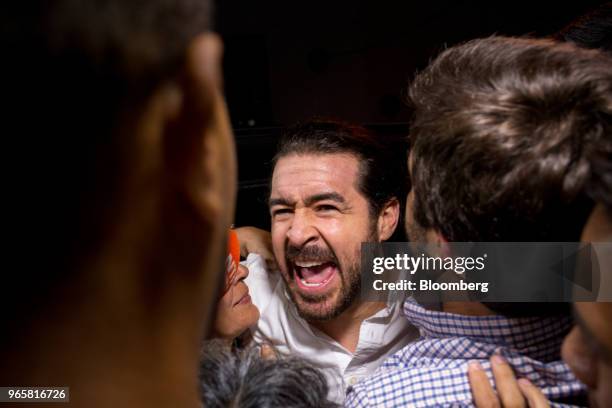 Daniel Ceballos, former San Cristobal mayor, center, is greeted by supporters after being released outside the Bolivarian Intelligence Service prison...