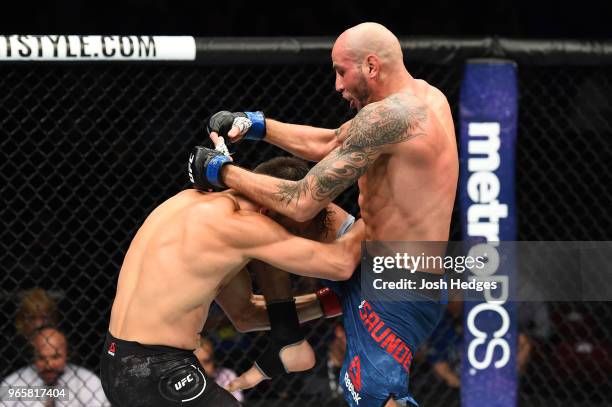 Ben Saunders lands a knee to the head of Jake Ellenberger in their welterweight fight during the UFC Fight Night event at the Adirondack Bank Center...