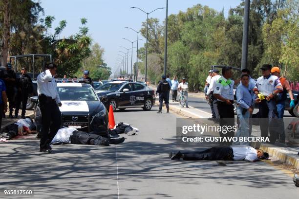 Graphic content / Municipal police officers and paramedics arrive at the scene where other police officers were killed during an armed attack in...