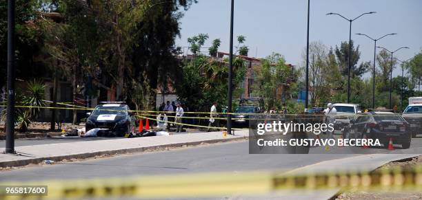 Graphic content / Municipal police officers and paramedics arrive at the scene where other police officers were killed during an armed attack in...