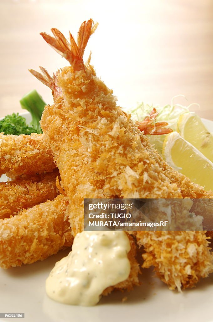 Plate of deep fried shrimps, close up