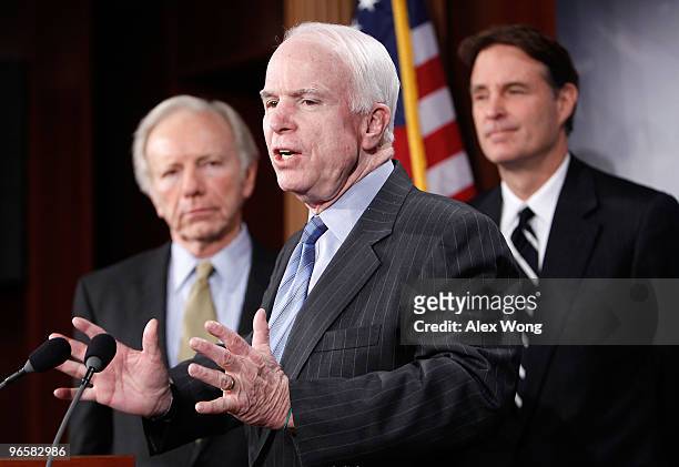 Sen. John McCain speaks as Sen. Joseph Lieberman , and Sen. Evan Bayh listen during a news conference on Capitol Hill February 11, 2010 in...