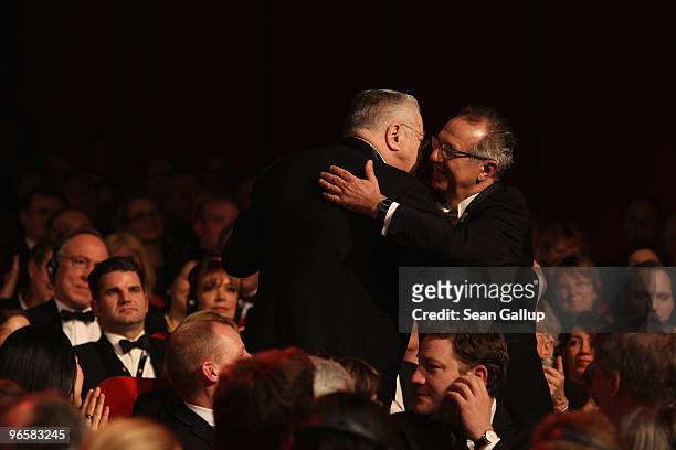 Former Festival director Moritz de Hadeln hugs Dieter Kosslick during the Opening Ceremony of the 60th Berlin International Film Festival at the...
